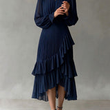 Vestido midi plisado elegante con volantes